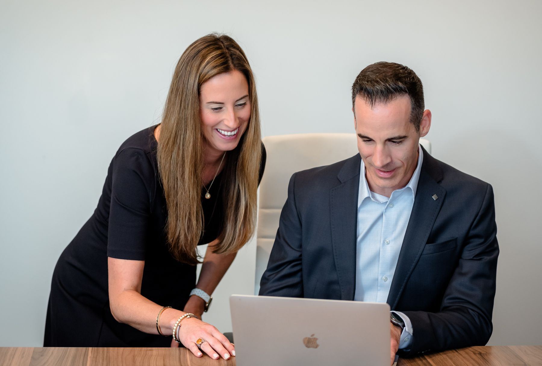 Laura Anderson and Dave Del Cotto reviewing data together